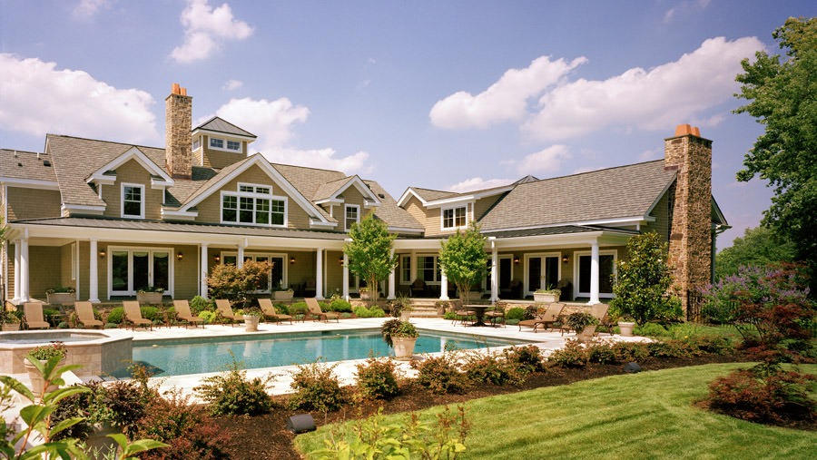 Farmhouse rear exterior with pool