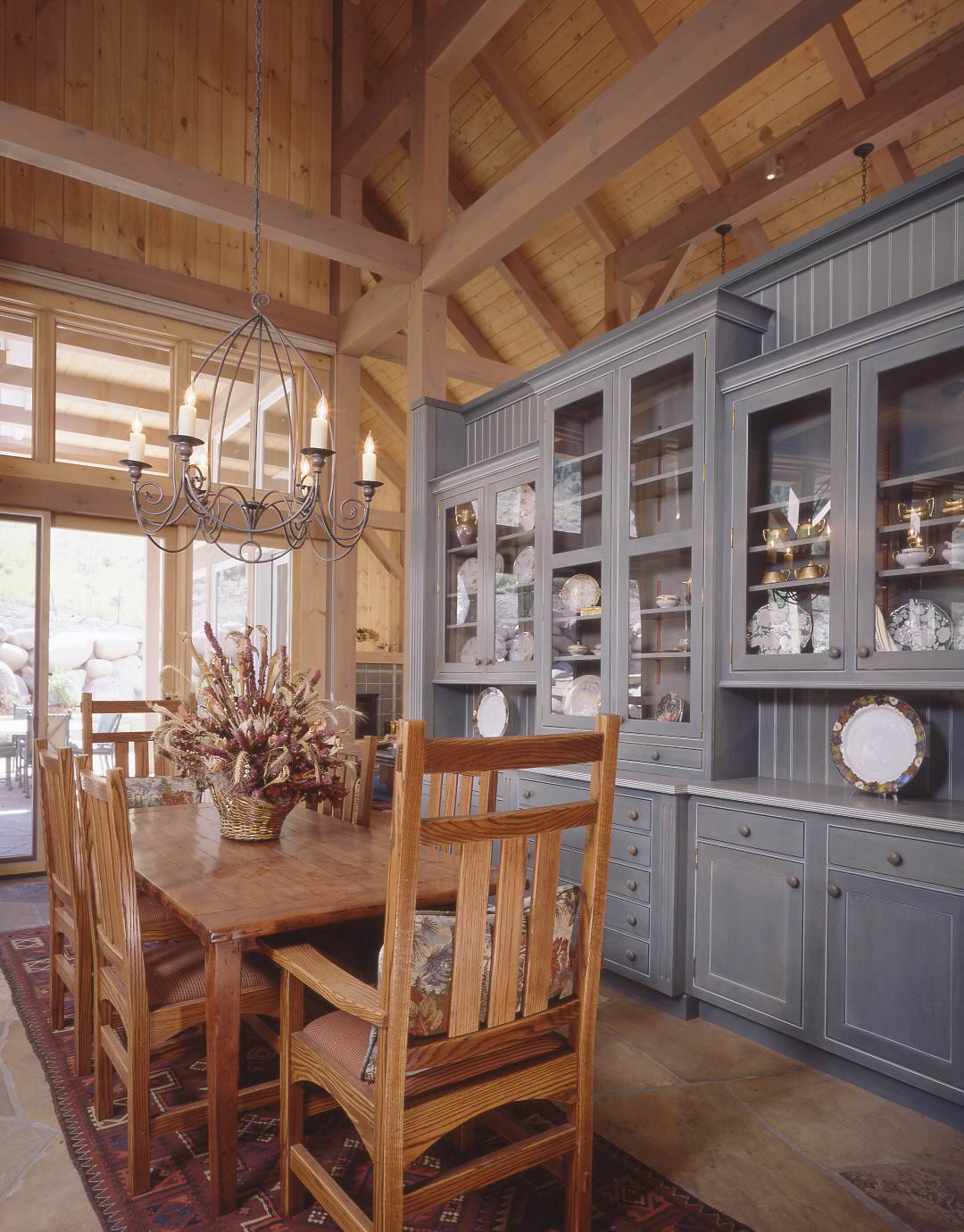 post and beam dining room with field stone floor