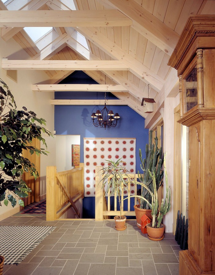 post and beam stair landing with tile floor