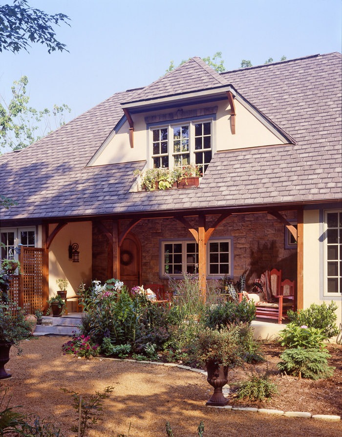 tuscan style home with inset dormer