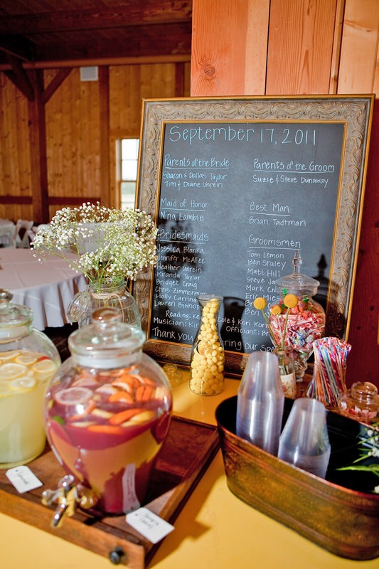 barn wedding welcome table with refreshments