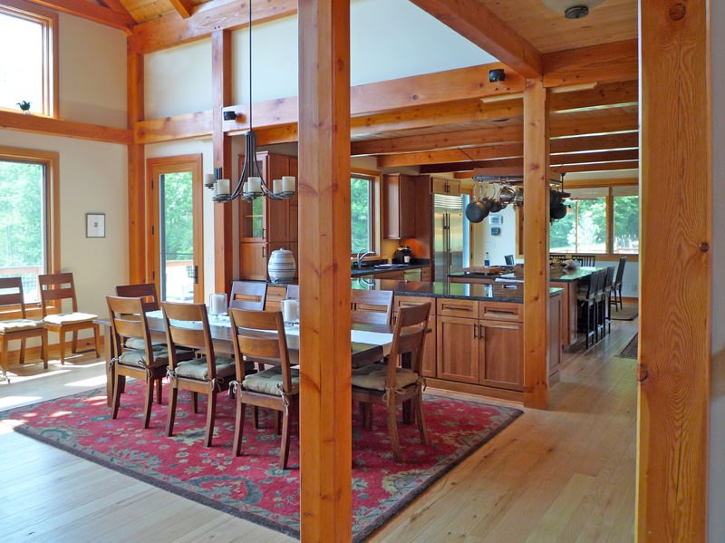 post and beam kitchen and dining room with cathedral ceiling