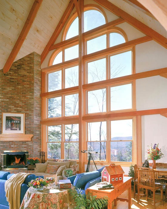 post and beam great room with wall of windows