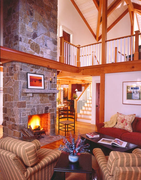 post and beam great room with stone fireplace