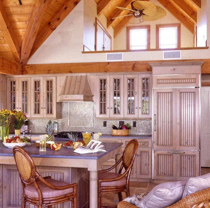 post and beam kitchen with vaulted ceilings and backsplash