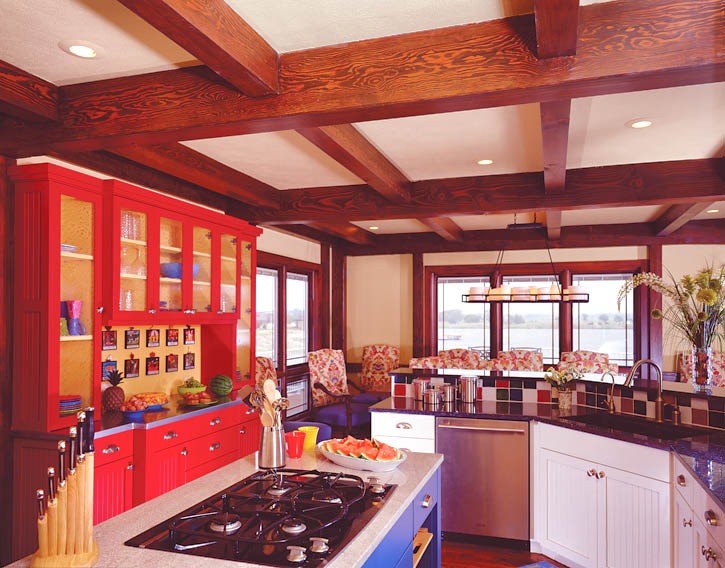 post and beam kitchen with multi colored cabinets