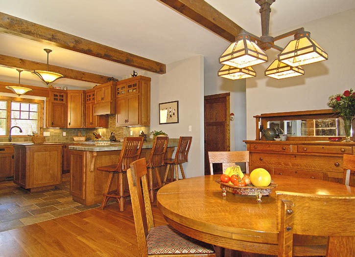 post and beam kitchen and dining room with craftsman lighting