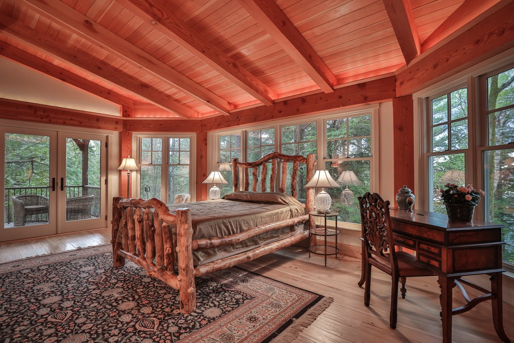 timber frame bedroom with log bed