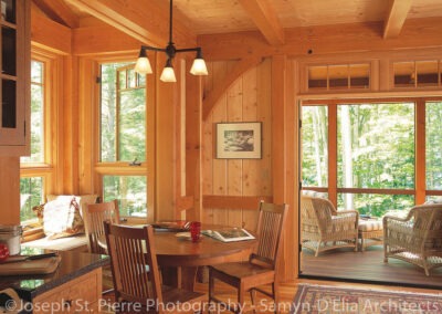 Intervale Pond Home Sandwich NH (5105) dining area looking out towards screen porch