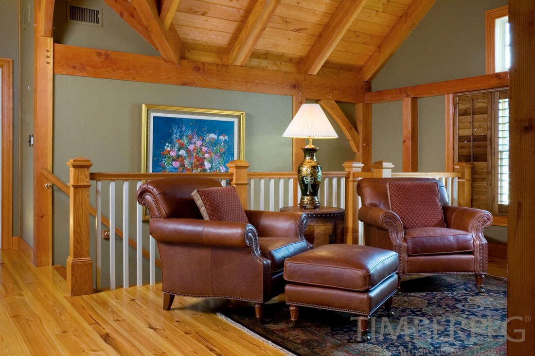 Farmingdale Farmhouse (5311) loft seating area with leather armchairs and ottoman
