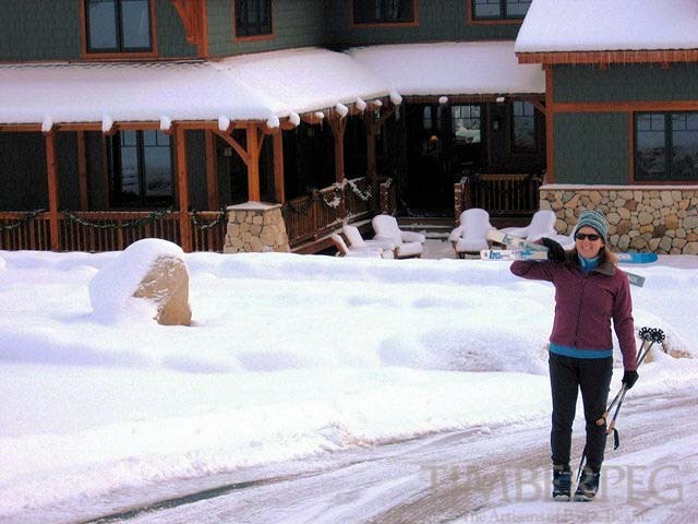 Jobs Peak, NV (5679) exterior view with woman carrying skis