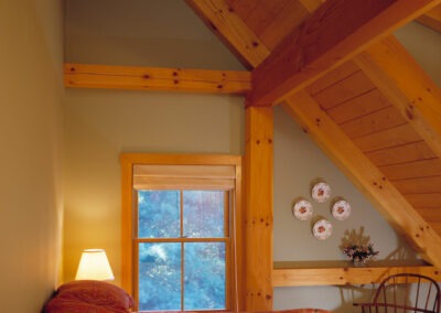 5969 Winhall Ski Retreat bedroom with sloped roof and timber frame