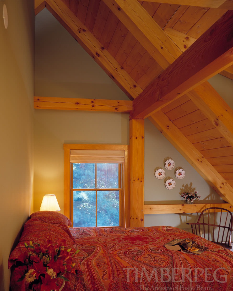 The Winhall Vermont (5969) bedroom with sloped roof and timber frame