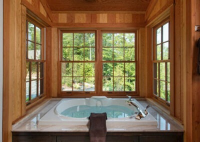 North Country, NH (T00490) bathtub surrounded by windows on three sides