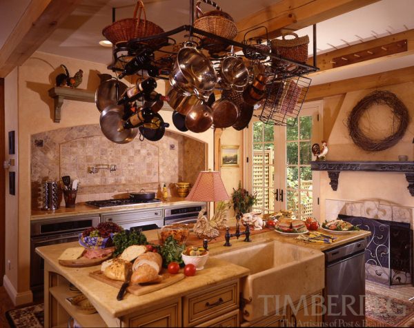 Charlottesville VA (5472) kitchen including large island with farmhouse style sink and copper cookware hanging above