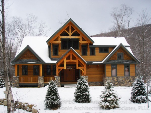Timber frame house in snow