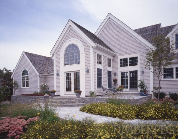 Exterior view with yellow flowers lining the walkway