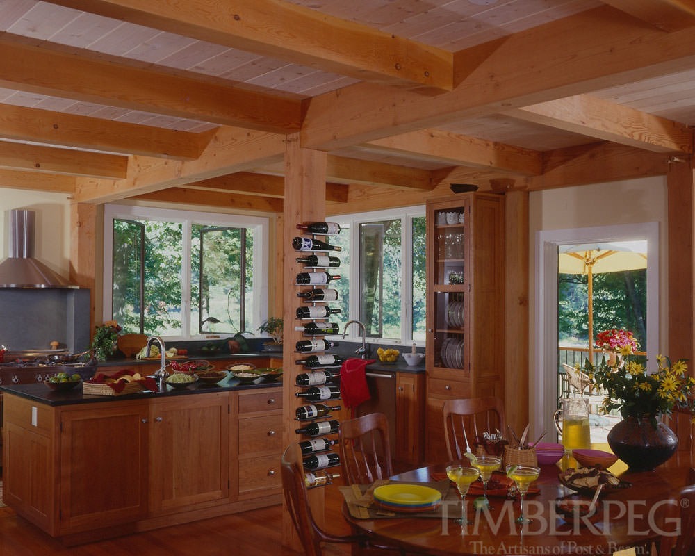 Kitchen featuring post with wine rack and glass cabinet