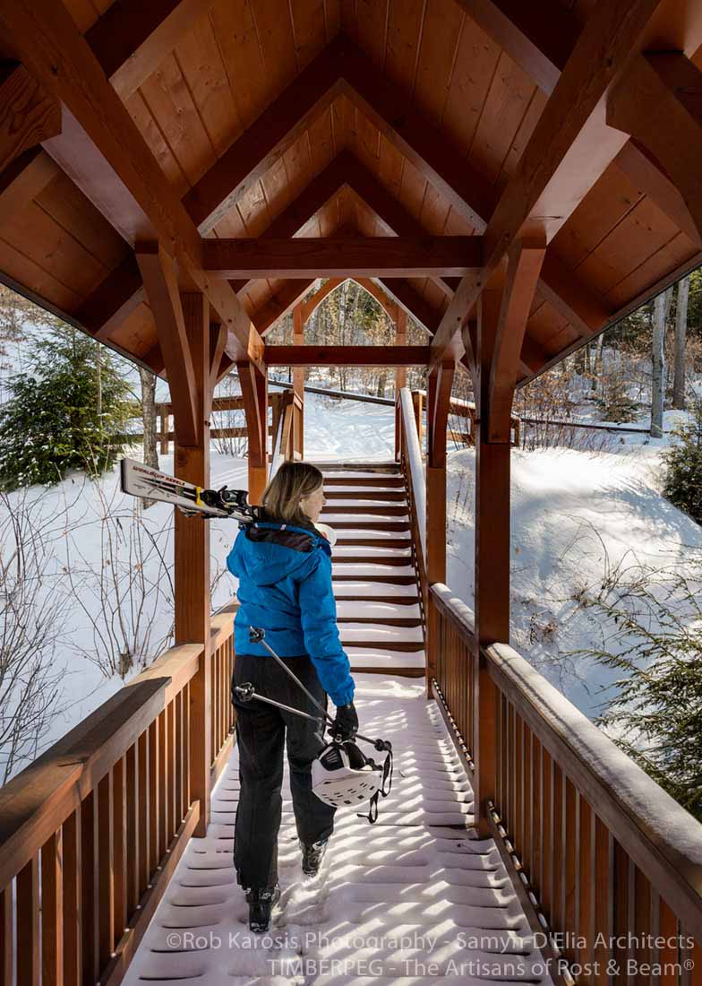 Lincoln Ski Home skier walking up covered walkway to ski trails