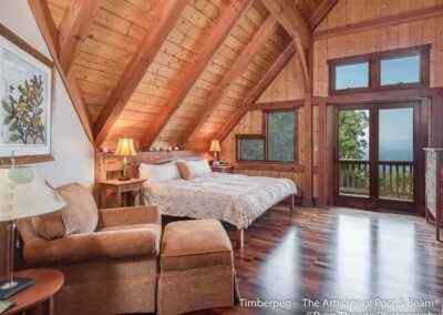 Leconte, Asheville, NC (5607) bedroom with sloped ceiling and doors out to deck