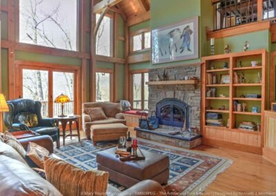 Fairview Cottage NC (5863) great room with cathedral ceilings, large window wall and stone fireplace