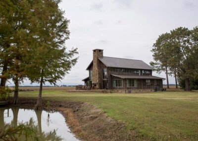 Hunting Lodge, AR (T01240) exterior view by water