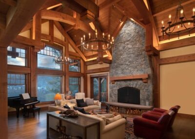 Loon Mountain great room featuring large fireplace and window wall