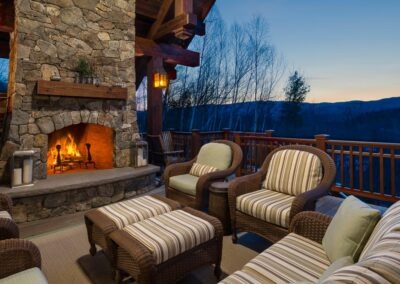 Loon Mountain covered deck with mountain view and outdoor fireplace
