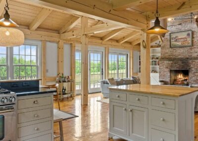 Old Chatham Barn Home with an open kitchen and fireplace.