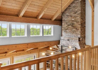 Old Chatham Barn Home with wood beams and a fireplace.