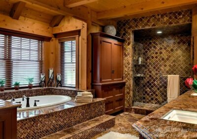 Loon Mountain Ski Home master bathroom with tub and shower