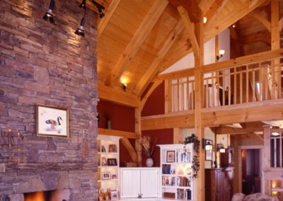 Lake Lure (5469) great room view up towards loft area, featuring beautiful timber frame and cathedral ceilings