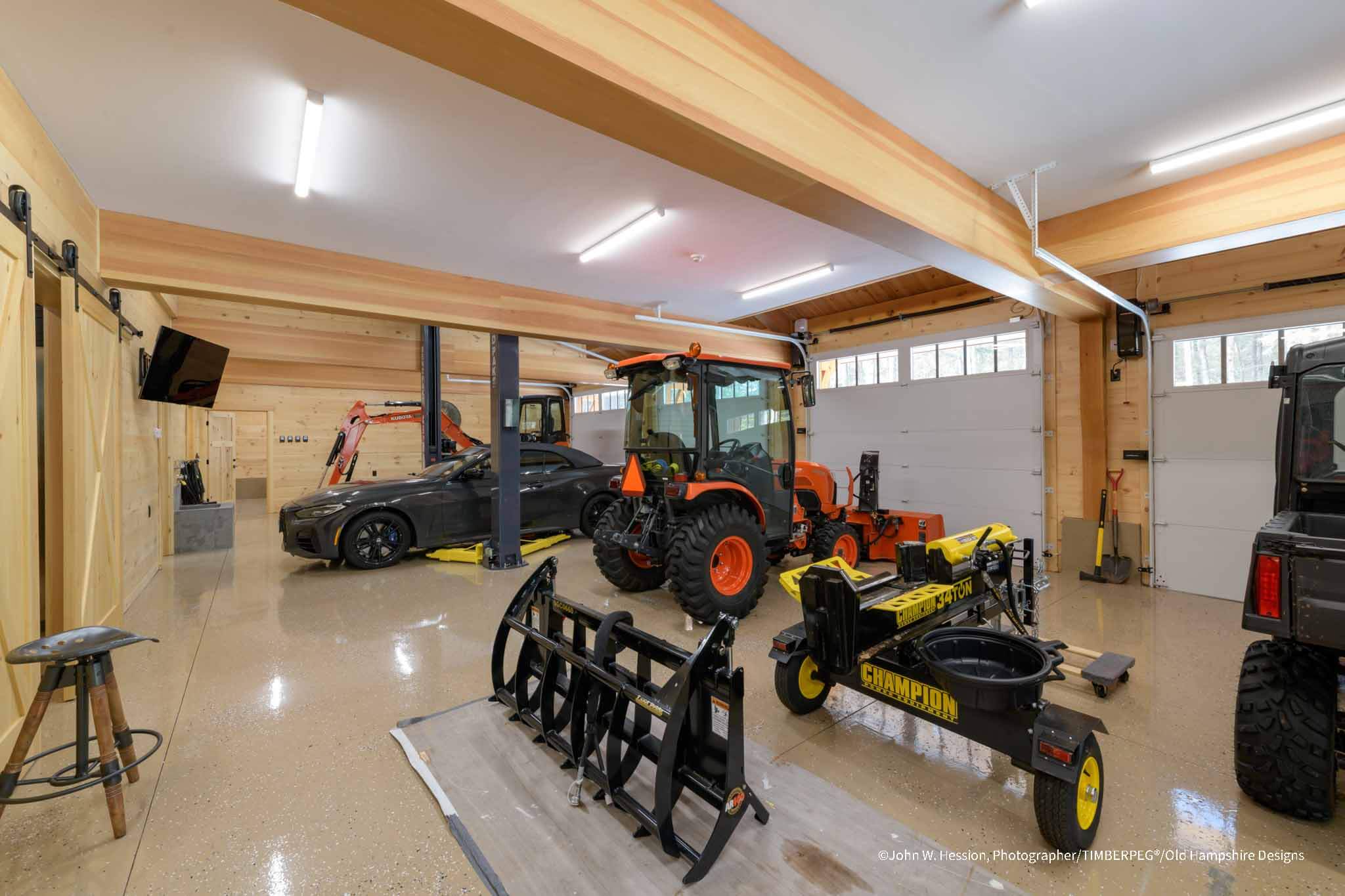Party Barn and Guest House garage floor with various vehicles and equipment