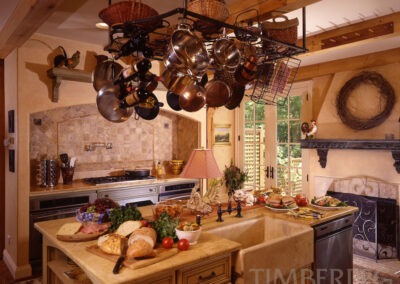 Charlottesville VA (5472) kitchen with large island with farmhouse style sink and copper cookware hanging above