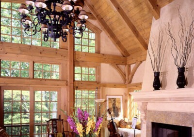 Charlottesville VA (5472) great room featuring cathedral ceiling, large window wall, and stone fireplace with plaster, tapered chiminey.