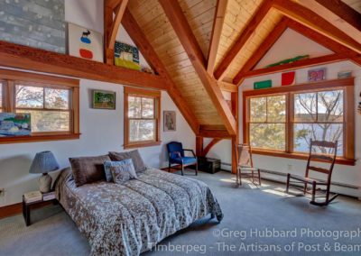Birch Point T00352 bedroom with timber frame ceiling and view to lake sunapee