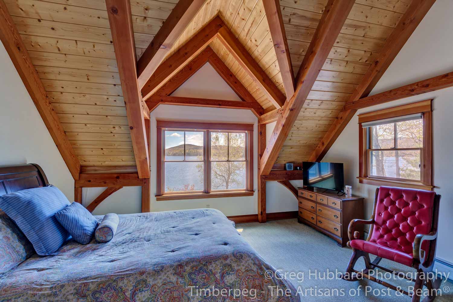 Birch Point T00352 bedroom with timber frame ceiling and view over water of lake sunapee