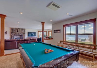 Birch Point T00352 pool table and downstairs fireplace, along with views out to Lake Sunapee