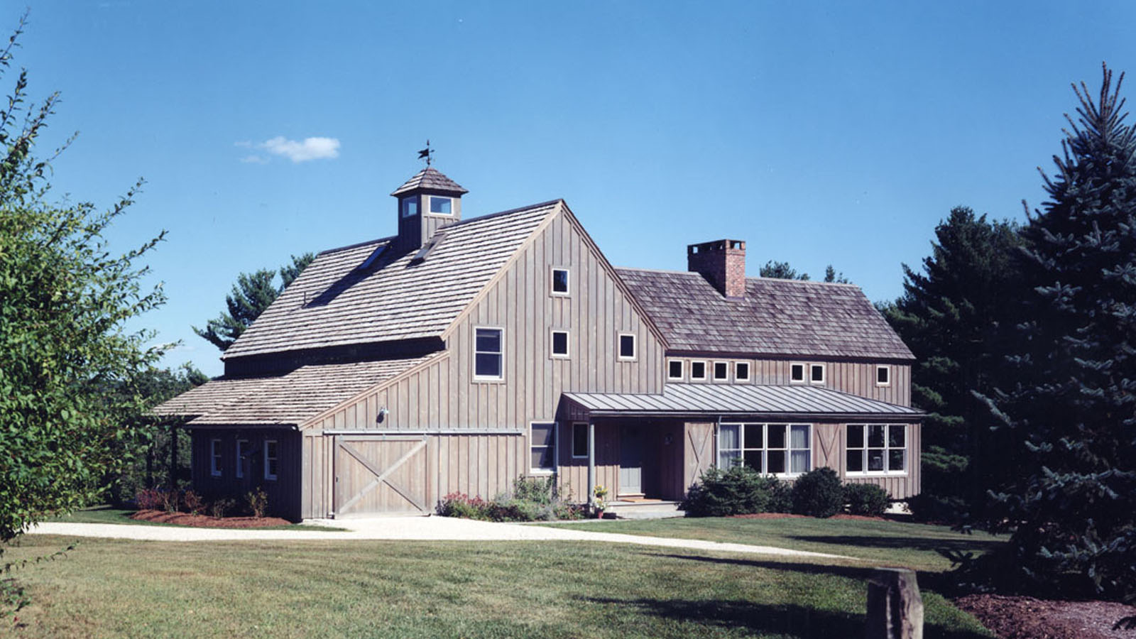 4500 Connecticut Barn Home exterior featuring board and batten siding and barn style doors