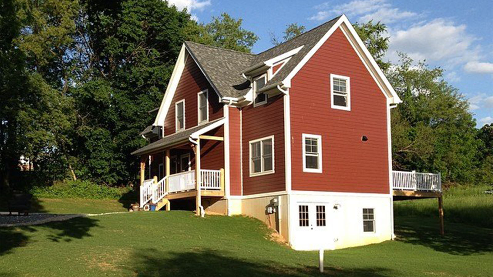 Stewartstown PA (T00806) exterior view of red timber frame home
